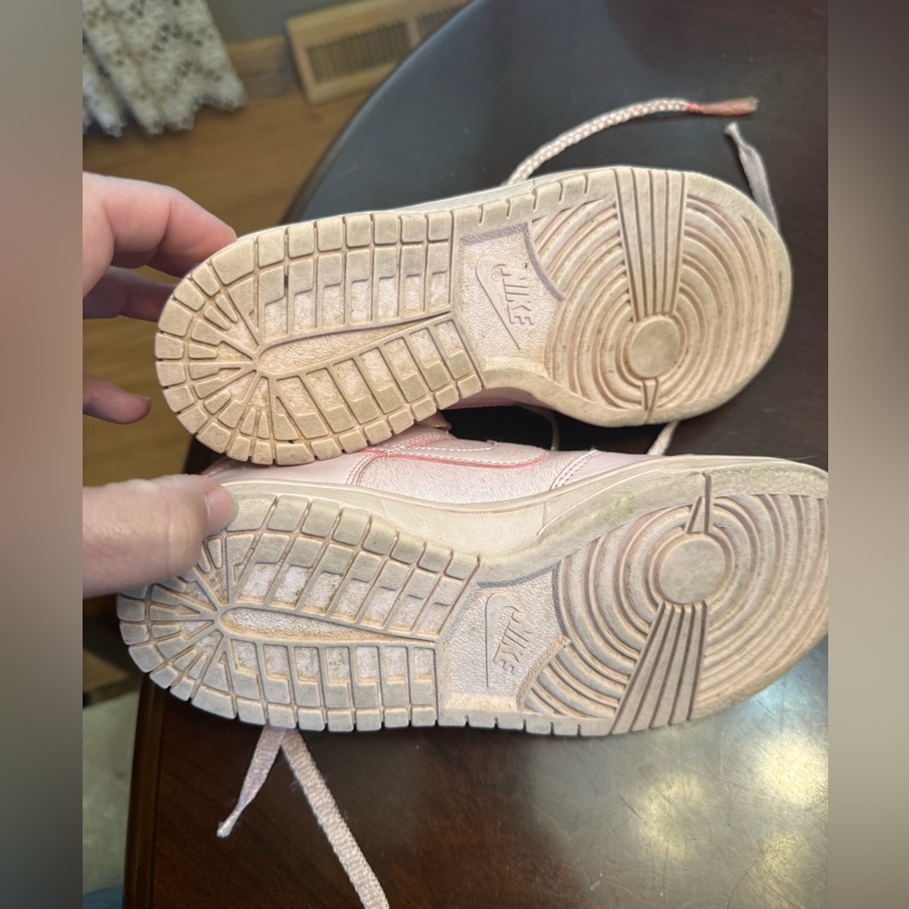 Nike dunks low-top.  Light pink